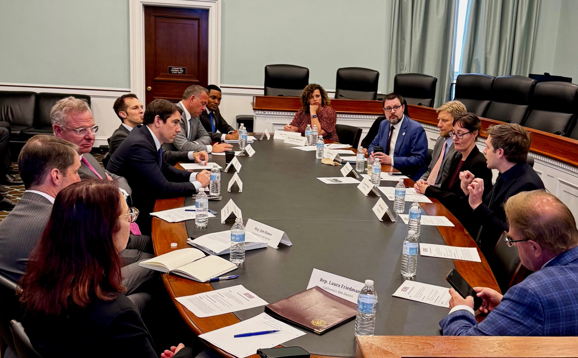 caucus members around a table