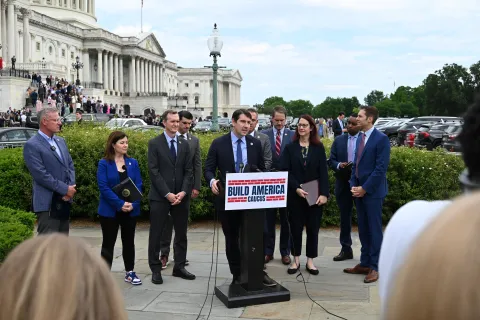 caucus members around a table